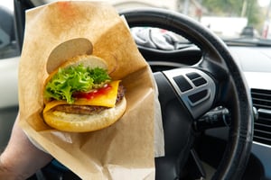 Fast food burger in car